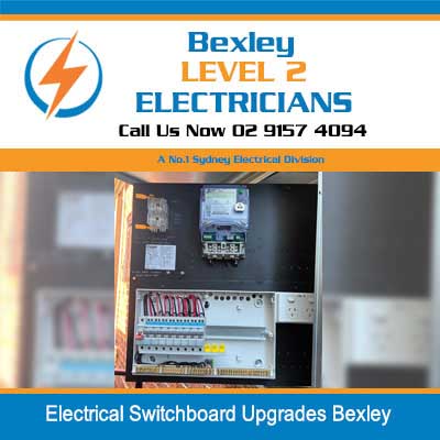 Level 2 electrician installing upgraded electrical switchboard with modern safety components in Bexley